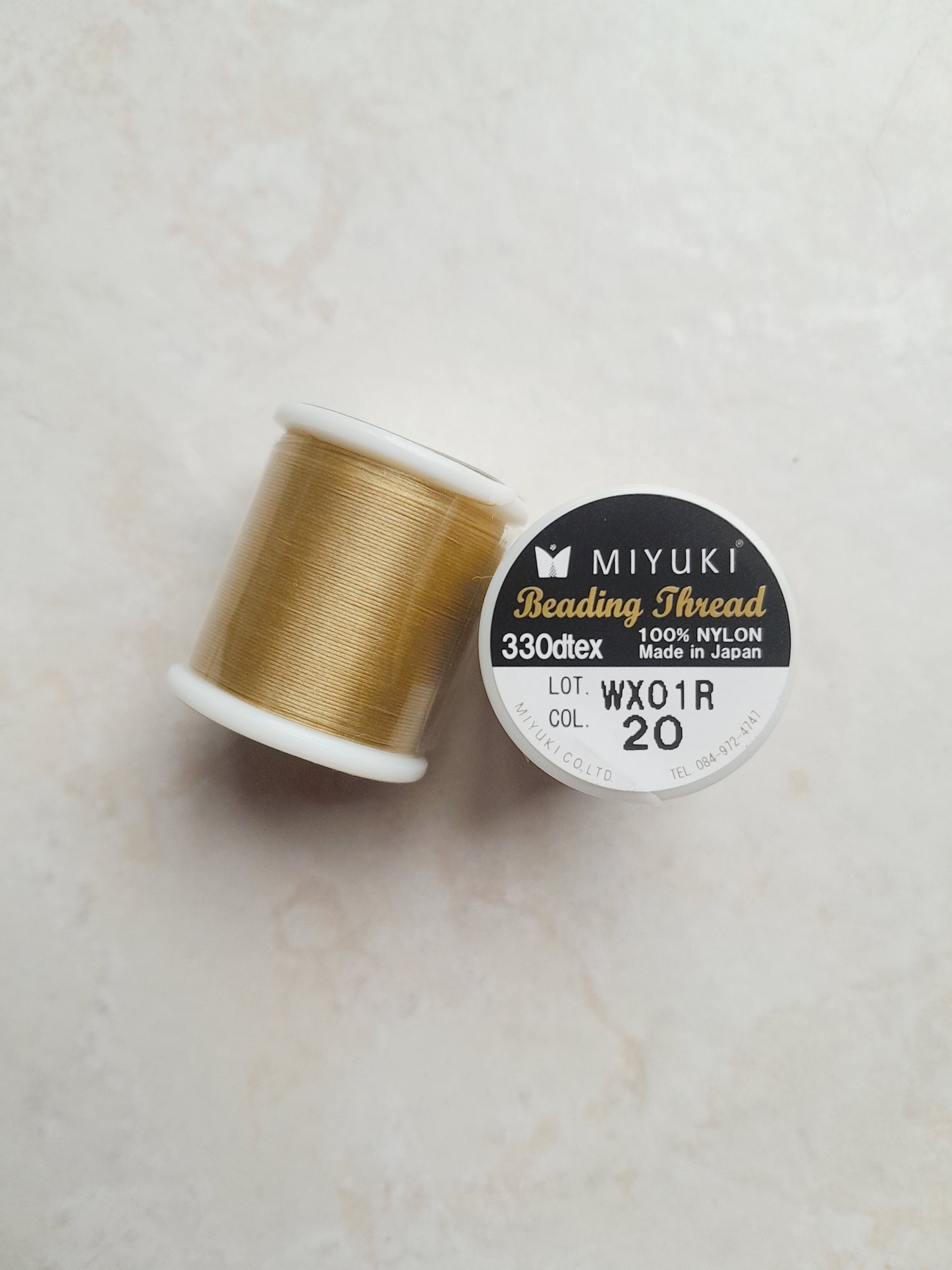 1 bobine de 50m fil nylon MIYUKI couleur Gold champagne 20
