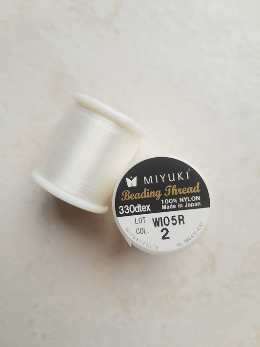 1 bobine de 50m fil nylon MIYUKI couleur ivory 02